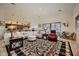 Open floor plan with a large sectional sofa and access to kitchen at 4590 S Gold Canyon Dr, Gold Canyon, AZ 85118