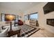 Spacious living area with large windows, fireplace and ample seating at 4590 S Gold Canyon Dr, Gold Canyon, AZ 85118