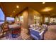 Covered patio with seating area and fire pit at 4590 S Gold Canyon Dr, Gold Canyon, AZ 85118