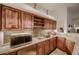 Well-equipped basement wet bar with ample storage and a microwave at 4590 S Gold Canyon Dr, Gold Canyon, AZ 85118