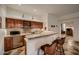Basement wet bar with wood cabinets, tile counters, and a microwave at 4590 S Gold Canyon Dr, Gold Canyon, AZ 85118