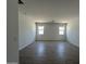 Comfortable bedroom with a bright window and tile flooring at 46905 W Old Timer Rd, Maricopa, AZ 85139