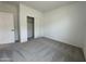 Spacious bedroom with plush carpeting, large closet, neutral paint, and bright, welcoming atmosphere at 46905 W Old Timer Rd, Maricopa, AZ 85139
