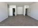Spacious bedroom showing entrances to a bathroom and a closet at 46905 W Old Timer Rd, Maricopa, AZ 85139