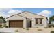 One-story home with brown garage door and light-colored exterior at 46905 W Old Timer Rd, Maricopa, AZ 85139