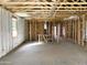 Interior view of a home under construction, displaying the framed walls and the open space at 46905 W Old Timer Rd, Maricopa, AZ 85139