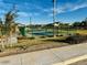 Community tennis court surrounded by green space at 46905 W Old Timer Rd, Maricopa, AZ 85139