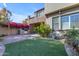 Backyard patio with built-in grill and artificial turf at 4700 S Fulton Ranch Blvd # 62, Chandler, AZ 85248