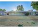 House back elevation with covered patio and grassy backyard at 4914 E Lake Point Cir, Phoenix, AZ 85044