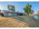 Landscaped backyard with lake view and patio at 4914 E Lake Point Cir, Phoenix, AZ 85044