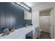 Modern bathroom with quartz vanity and blue wall at 4914 E Lake Point Cir, Phoenix, AZ 85044