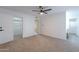 Spacious bedroom with mirrored closet doors and ceiling fan at 4914 E Lake Point Cir, Phoenix, AZ 85044