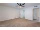 Well-lit bedroom with ceiling fan and closet at 4914 E Lake Point Cir, Phoenix, AZ 85044