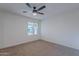 Bright bedroom with window and ceiling fan at 4914 E Lake Point Cir, Phoenix, AZ 85044