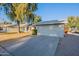 Single-story home with attached garage and a spacious front yard at 4914 E Lake Point Cir, Phoenix, AZ 85044