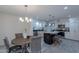 Updated kitchen features an island, stainless steel appliances, and dining area at 4914 E Lake Point Cir, Phoenix, AZ 85044