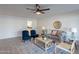 Bright living room with lake view, comfy seating, and stylish decor at 4914 E Lake Point Cir, Phoenix, AZ 85044
