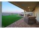 Covered patio and artificial turf in the backyard at 4928 W Capistrano Ave, Laveen, AZ 85339