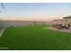 Artificial turf and a patio with seating area at 4928 W Capistrano Ave, Laveen, AZ 85339