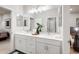 Double vanity bathroom with white cabinets and gray hexagon floor at 4928 W Capistrano Ave, Laveen, AZ 85339