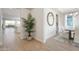 Bright entryway with wood-look floors, leading to dining and kitchen areas at 4928 W Capistrano Ave, Laveen, AZ 85339