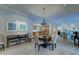 Open concept dining area with tile flooring and views of the kitchen and living room areas at 5432 E Paradise Dr, Scottsdale, AZ 85254