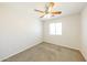 Bright bedroom with ceiling fan and double door closet at 5866 S 237Th Ln, Buckeye, AZ 85326