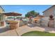 Outdoor kitchen with grill and bar seating at 6023 W Kimberly Way, Glendale, AZ 85308