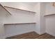 Walk-in closet with wood floors and ample shelving at 6023 W Kimberly Way, Glendale, AZ 85308