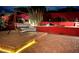 Inviting backyard featuring a swing, desert flora, and festive lighting on the privacy wall at 6720 E Phelps Rd, Scottsdale, AZ 85254