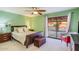 Comfortable bedroom with a king-size bed and a sliding glass door to the backyard at 6720 E Phelps Rd, Scottsdale, AZ 85254