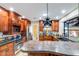 Stunning kitchen boasts custom cabinets, stainless steel appliances, granite counters, and unique backsplash at 6720 E Phelps Rd, Scottsdale, AZ 85254