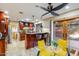 Entertain in this inviting kitchen, featuring a breakfast bar, stone floors and access to the backyard at 6720 E Phelps Rd, Scottsdale, AZ 85254