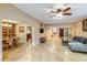 Spacious living room with neutral tones, tile floors and a seamless flow into the dining area at 6720 E Phelps Rd, Scottsdale, AZ 85254