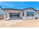 Home's backyard featuring a covered patio with sliding glass doors at 6727 N 9Th Dr, Phoenix, AZ 85013