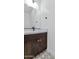 Close up of a bathroom vanity with a modern faucet and stylish cabinet hardware at 6727 N 9Th Dr, Phoenix, AZ 85013