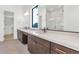 Elegant bathroom with dual sinks, a large mirror, and a glass-enclosed shower at 6727 N 9Th Dr, Phoenix, AZ 85013
