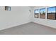 Bright, modern bedroom with multiple windows, neutral carpet and white paint at 6727 N 9Th Dr, Phoenix, AZ 85013