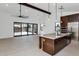 Modern kitchen featuring a large island with white countertops and stainless steel appliances at 6727 N 9Th Dr, Phoenix, AZ 85013