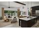 Open concept kitchen with island, stainless steel appliances, and white cabinetry at 6727 N 9Th Dr, Phoenix, AZ 85013