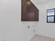 Laundry room featuring cabinets for storage and a window for natural light at 6727 N 9Th Dr, Phoenix, AZ 85013