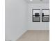Bright room with multiple windows, neutral floor and white paint at 6727 N 9Th Dr, Phoenix, AZ 85013