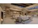 Open floor plan great room with a wet bar, fireplace, and modern sofas at 7256 N 40Th St # 6, Paradise Valley, AZ 85253