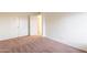 Bedroom with carpet, double door closet and access to bathroom at 8446 N 34Th Dr, Phoenix, AZ 85051