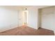 Bedroom with carpet, closet and door to bathroom at 8446 N 34Th Dr, Phoenix, AZ 85051