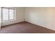 Bright bedroom with carpet flooring and a window at 8446 N 34Th Dr, Phoenix, AZ 85051