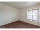 Spacious bedroom with brown carpet and window at 8446 N 34Th Dr, Phoenix, AZ 85051