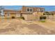 Tan two-story townhome with wood fence and landscaping at 8446 N 34Th Dr, Phoenix, AZ 85051
