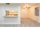 Small kitchen with granite countertop and bar seating at 8446 N 34Th Dr, Phoenix, AZ 85051