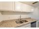 Kitchen features granite countertops and cabinets at 8446 N 34Th Dr, Phoenix, AZ 85051